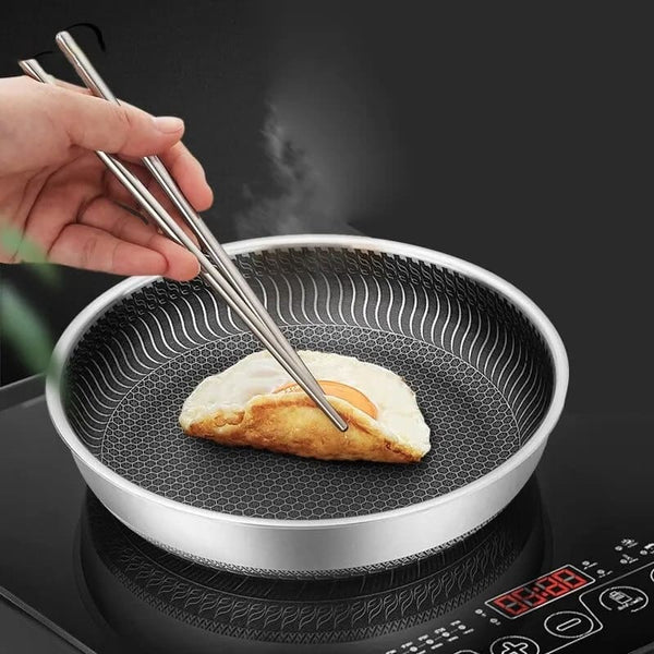 stainless_steel_skillet_frying_egg.